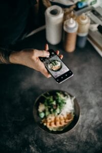 influencer taking photo of food